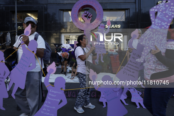 Mothers, relatives of missing persons and victims of femicide, feminist collectives, and various organizations hold silhouettes while protes...