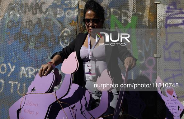 Mothers, relatives of missing persons and victims of femicide, feminist collectives, and various organizations hold silhouettes while protes...