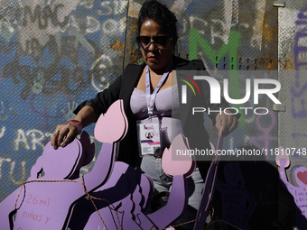 Mothers, relatives of missing persons and victims of femicide, feminist collectives, and various organizations hold silhouettes while protes...