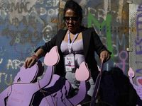 Mothers, relatives of missing persons and victims of femicide, feminist collectives, and various organizations hold silhouettes while protes...