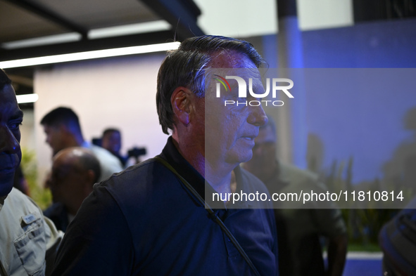 Former Brazilian President Jair Bolsonaro speaks to the press after arriving at Brasilia airport in Brasilia, Brazil, on November 25, 2024....