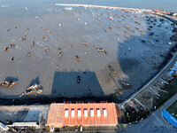 Fishing boats berth in the harbor to take shelter from the cold wave and wind at the central fishing port of Liandao in Lianyungang, Jiangsu...