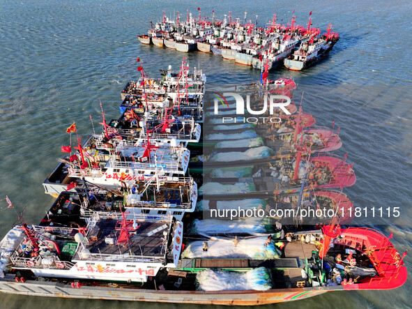 Fishing boats berth in the harbor to take shelter from the cold wave and wind at the central fishing port of Liandao in Lianyungang, Jiangsu...