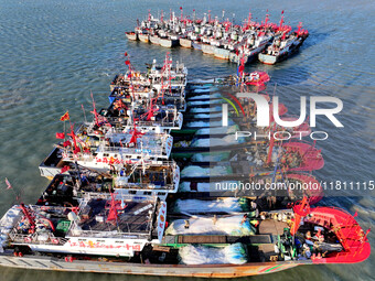 Fishing boats berth in the harbor to take shelter from the cold wave and wind at the central fishing port of Liandao in Lianyungang, Jiangsu...