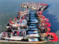 Fishing boats berth in the harbor to take shelter from the cold wave and wind at the central fishing port of Liandao in Lianyungang, Jiangsu...