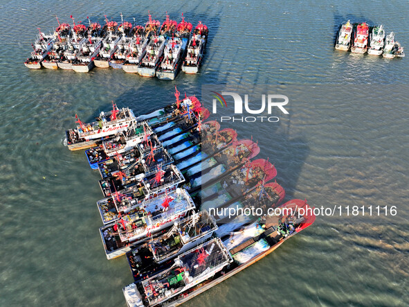 Fishing boats berth in the harbor to take shelter from the cold wave and wind at the central fishing port of Liandao in Lianyungang, Jiangsu...