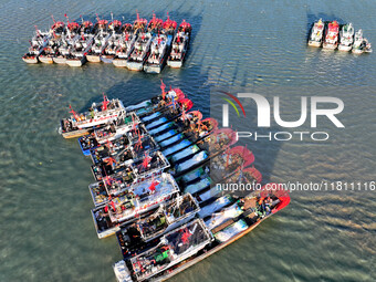 Fishing boats berth in the harbor to take shelter from the cold wave and wind at the central fishing port of Liandao in Lianyungang, Jiangsu...