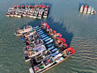 Fishing boats berth in the harbor to take shelter from the cold wave and wind at the central fishing port of Liandao in Lianyungang, Jiangsu...