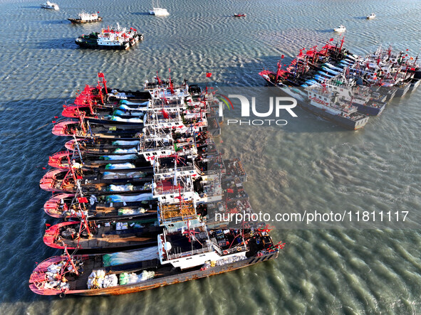 Fishing boats berth in the harbor to take shelter from the cold wave and wind at the central fishing port of Liandao in Lianyungang, Jiangsu...