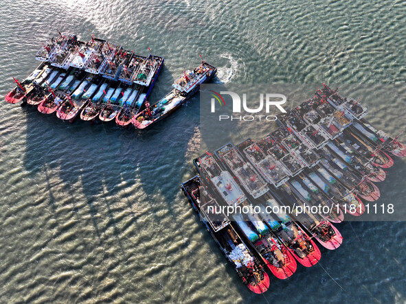 Fishing boats berth in the harbor to take shelter from the cold wave and wind at the central fishing port of Liandao in Lianyungang, Jiangsu...