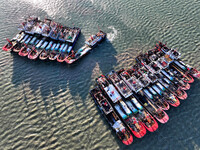 Fishing boats berth in the harbor to take shelter from the cold wave and wind at the central fishing port of Liandao in Lianyungang, Jiangsu...