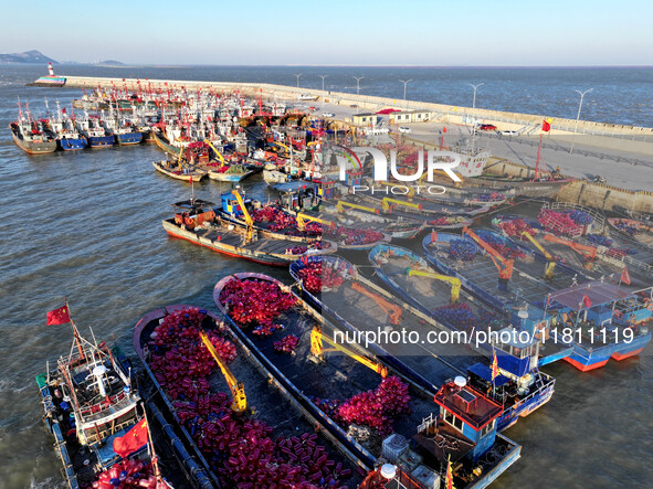 Fishing boats berth in the harbor to take shelter from the cold wave and wind at the central fishing port of Liandao in Lianyungang, Jiangsu...