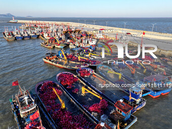 Fishing boats berth in the harbor to take shelter from the cold wave and wind at the central fishing port of Liandao in Lianyungang, Jiangsu...