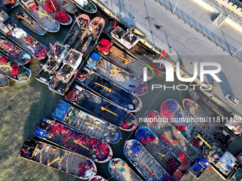 Fishing boats berth in the harbor to take shelter from the cold wave and wind at the central fishing port of Liandao in Lianyungang, Jiangsu...