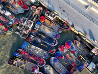 Fishing boats berth in the harbor to take shelter from the cold wave and wind at the central fishing port of Liandao in Lianyungang, Jiangsu...