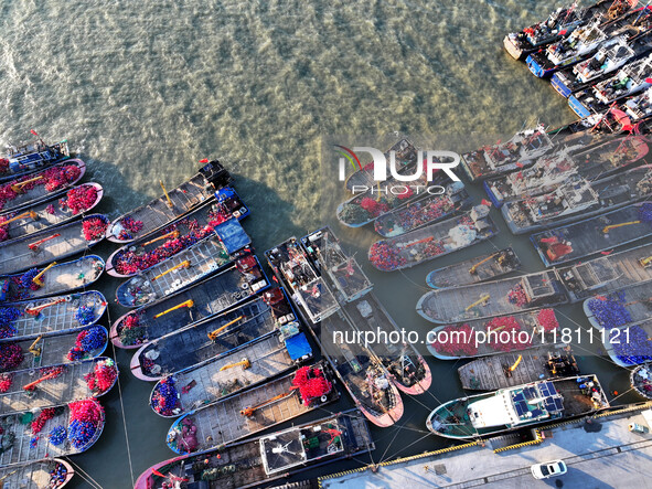 Fishing boats berth in the harbor to take shelter from the cold wave and wind at the central fishing port of Liandao in Lianyungang, Jiangsu...