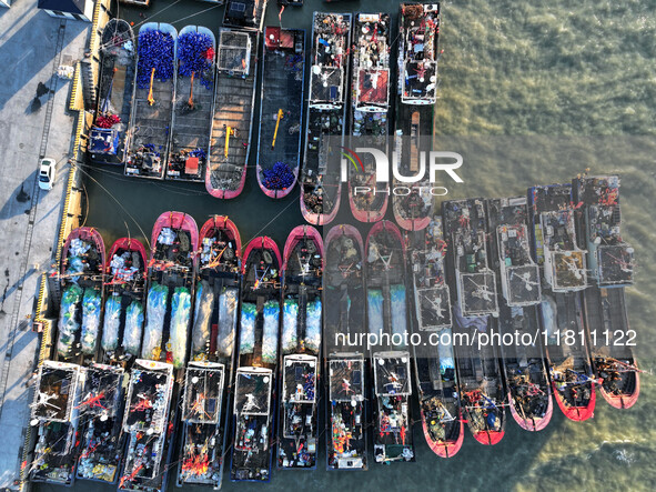 Fishing boats berth in the harbor to take shelter from the cold wave and wind at the central fishing port of Liandao in Lianyungang, Jiangsu...