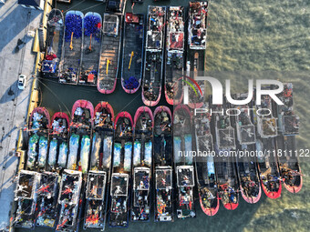 Fishing boats berth in the harbor to take shelter from the cold wave and wind at the central fishing port of Liandao in Lianyungang, Jiangsu...