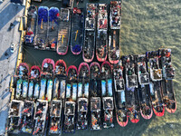 Fishing boats berth in the harbor to take shelter from the cold wave and wind at the central fishing port of Liandao in Lianyungang, Jiangsu...