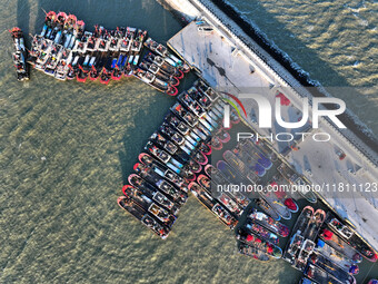 Fishing boats berth in the harbor to take shelter from the cold wave and wind at the central fishing port of Liandao in Lianyungang, Jiangsu...