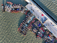 Fishing boats berth in the harbor to take shelter from the cold wave and wind at the central fishing port of Liandao in Lianyungang, Jiangsu...