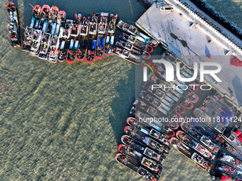 Fishing boats berth in the harbor to take shelter from the cold wave and wind at the central fishing port of Liandao in Lianyungang, Jiangsu...