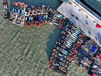 Fishing boats berth in the harbor to take shelter from the cold wave and wind at the central fishing port of Liandao in Lianyungang, Jiangsu...