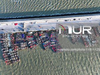 Fishing boats berth in the harbor to take shelter from the cold wave and wind at the central fishing port of Liandao in Lianyungang, Jiangsu...