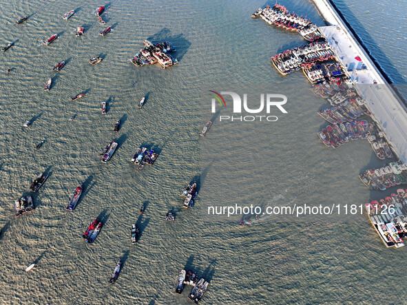 Fishing boats berth in the harbor to take shelter from the cold wave and wind at the central fishing port of Liandao in Lianyungang, Jiangsu...