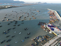 Fishing boats berth in the harbor to take shelter from the cold wave and wind at the central fishing port of Liandao in Lianyungang, Jiangsu...