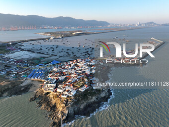 Fishing boats berth in the harbor to take shelter from the cold wave and wind at the central fishing port of Liandao in Lianyungang, Jiangsu...