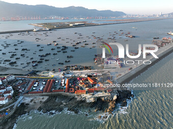 Fishing boats berth in the harbor to take shelter from the cold wave and wind at the central fishing port of Liandao in Lianyungang, Jiangsu...