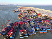 Fishing boats berth in the harbor to take shelter from the cold wave and wind at the central fishing port of Liandao in Lianyungang, Jiangsu...