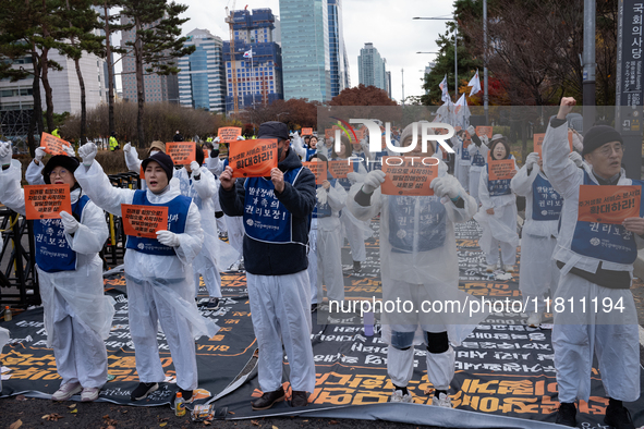 Members of the Korea Parents' Network for People with Disabilities stage the first day of their hunger strike in front of the National Assem...