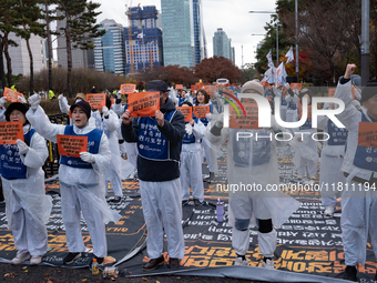 Members of the Korea Parents' Network for People with Disabilities stage the first day of their hunger strike in front of the National Assem...