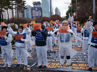 Members of the Korea Parents' Network for People with Disabilities stage the first day of their hunger strike in front of the National Assem...