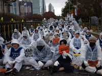 Members of the Korea Parents' Network for People with Disabilities stage the first day of their hunger strike in front of the National Assem...