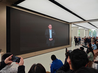 Customers line up outside Huawei's global flagship store to attend Huawei's Mate brand launch ceremony in Shanghai, China, on November 26, 2...