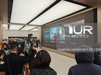 Customers line up outside Huawei's global flagship store to attend Huawei's Mate brand launch ceremony in Shanghai, China, on November 26, 2...