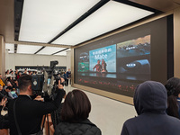 Customers line up outside Huawei's global flagship store to attend Huawei's Mate brand launch ceremony in Shanghai, China, on November 26, 2...