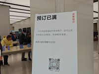 Customers line up outside Huawei's global flagship store to attend Huawei's Mate brand launch ceremony in Shanghai, China, on November 26, 2...