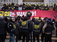 Over 100 members of the Cargo Truckers' Solidarity Division under the Korean Confederation of Trade Unions Public Transport Workers' Union s...