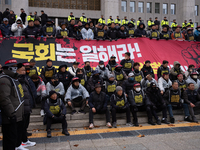 Over 100 members of the Cargo Truckers' Solidarity Division under the Korean Confederation of Trade Unions Public Transport Workers' Union s...