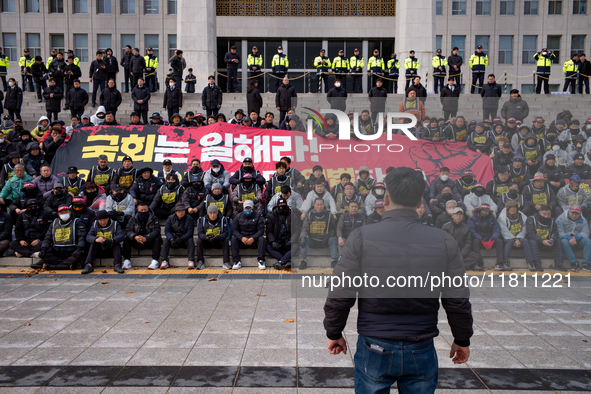 Over 100 members of the Cargo Truckers' Solidarity Division under the Korean Confederation of Trade Unions Public Transport Workers' Union s...