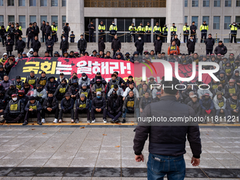 Over 100 members of the Cargo Truckers' Solidarity Division under the Korean Confederation of Trade Unions Public Transport Workers' Union s...