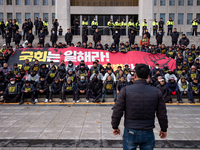 Over 100 members of the Cargo Truckers' Solidarity Division under the Korean Confederation of Trade Unions Public Transport Workers' Union s...