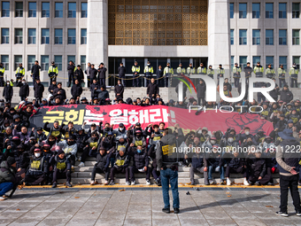 Over 100 members of the Cargo Truckers' Solidarity Division under the Korean Confederation of Trade Unions Public Transport Workers' Union s...