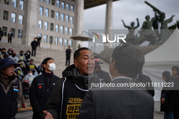 Over 100 members of the Cargo Truckers' Solidarity Division under the Korean Confederation of Trade Unions Public Transport Workers' Union s...