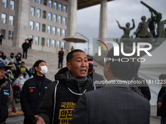 Over 100 members of the Cargo Truckers' Solidarity Division under the Korean Confederation of Trade Unions Public Transport Workers' Union s...