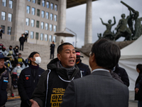 Over 100 members of the Cargo Truckers' Solidarity Division under the Korean Confederation of Trade Unions Public Transport Workers' Union s...